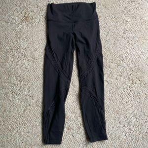 Lululemon leggings with mesh details across the thighs and shins